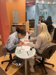 Student doing nails. 