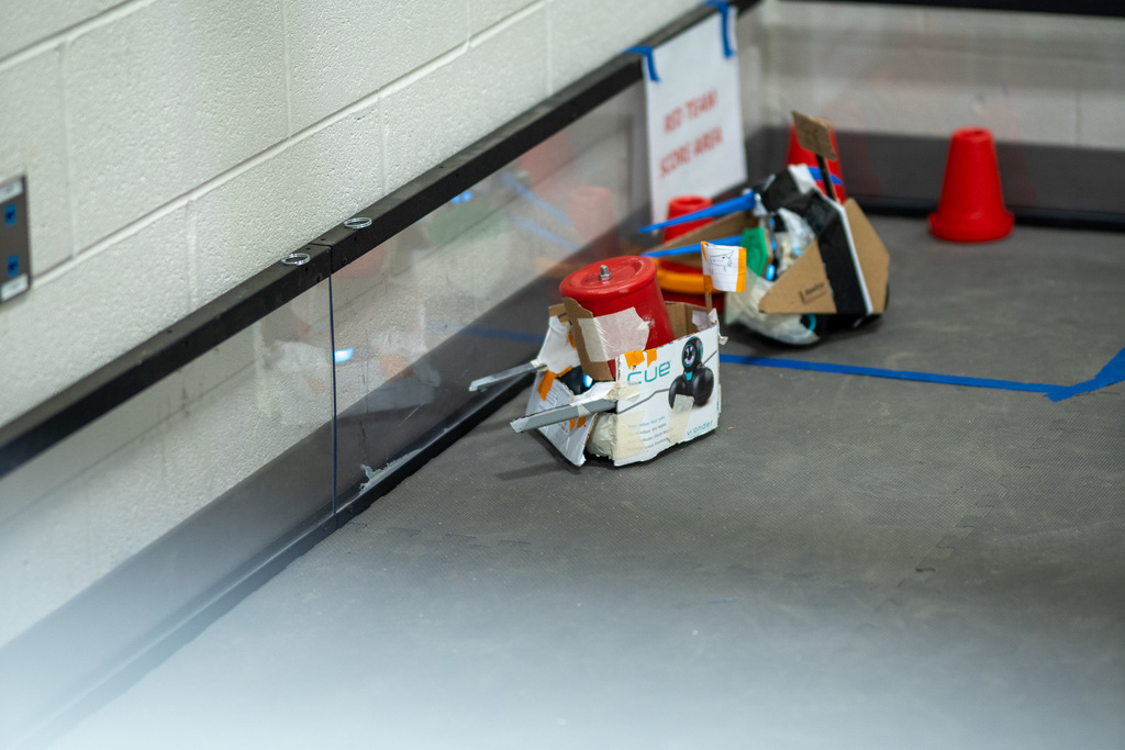 "Okay but how cool is this??? The Robotics Class held a tournament style Battlebots event!  Students could only create their bots using recycled materials found in the room and then only had 5 minutes to race to get the most cones to their score area!" 